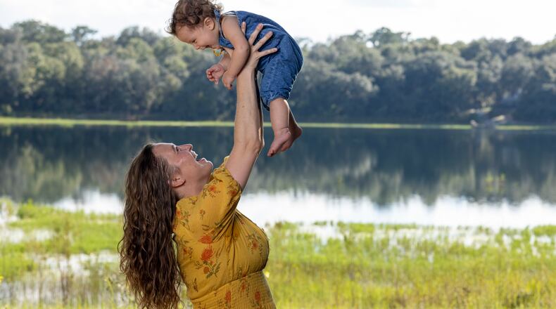 Mandi Rokx of Melrose, Florida, was cut from Medicaid three months after delivering her daughter, Vernita, in February. An unknown number of Florida mothers have been disenrolled from Medicaid despite being eligible for 12 months of continuous coverage. (David Steele for KFF Health News)