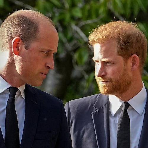 FILE - Britain's Prince William and Britain's Prince Harry walk beside each other after viewing the floral tributes for the late Queen Elizabeth II outside Windsor Castle, in Windsor, England on Sept. 10, 2022. (AP Photo/Martin Meissner, File)