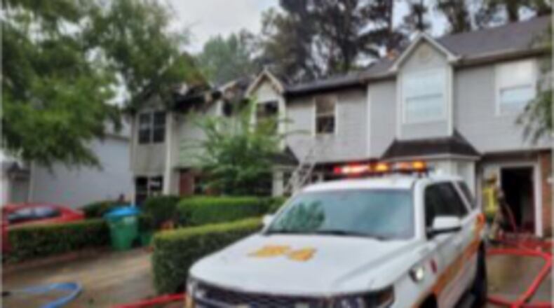 Authorities determined the fire started with a grill that was on the back porch of the townhome.