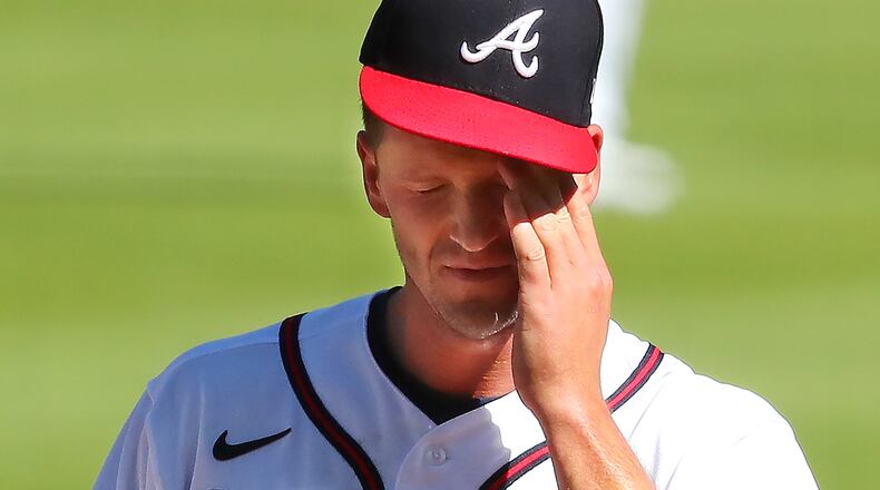 Braves starting pitcher Drew Smyly reacts after giving up a two-run homer to Arizona Diamondbacks David Peralta during the first inning of the second game of a doubleheader Sunday, April 25, 2021, at Truist Park in Atlanta. Smyly gave up five runs in the opening frame of a 7-0 loss. (Curtis Compton / Curtis.Compton@ajc.com)