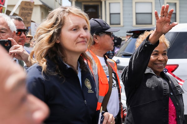 Assembly member Buffy Wicks, foreground, and Oakland Mayor Barbara Lee speak to the crowd at Wilma Chan Park before they march through downtown during a "No Kings” protest, Saturday, June 14, 2025, in Oakland, Calif. (Jessica Christian/San Francisco Chronicle via AP)
