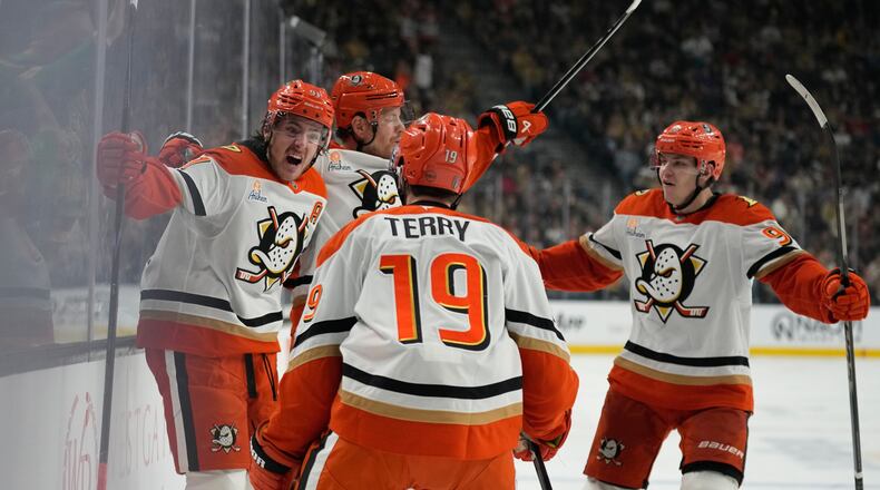 Anaheim Ducks center Leo Carlsson, left, celebrates after scoring against the Vegas Golden Knights during the third period of Game 2 of a second-round NHL hockey Stanley Cup playoff series Wednesday, May 6, 2026, in Las Vegas. (AP Photo/John Locher)