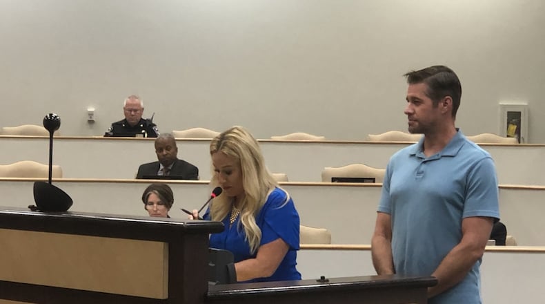 Kelly Willyard (right) and Steven Gasper appear before the Gwinnett County Board of Education at the June 18 meeting. ARLINDA SMITH BROADY/AJC