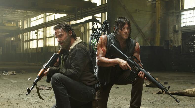 Andrew Lincoln as Rick Grimes and Norman Reedus as Daryl Dixon - The Walking Dead _ Season 5, Gallery - Photo Credit: Frank Ockenfels 3/AMC Our buds Andrew Lincoln and Norman Reedus in a pickle as usual. CREDIT: AMC