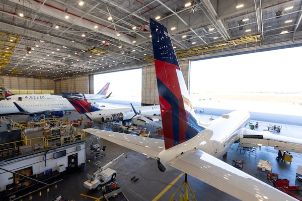 Delta airplanes are parked at a Delta TechOps hanger in Atlanta on Monday, October 20, 2025. (Arvin Temkar/AJC)