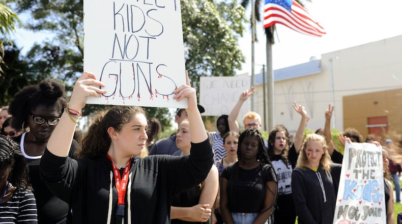G Star School of the Arts students participate in a walkout from school in protest of gun violence Wednesday Feb. 21, 2018 in West Palm Beach. “It is ridiculous that we have to be out here protesting gun violence,” said student Zoe Overholser, 16. The students stood in front of the school and observed 17 minutes of silence for each of the Marjory Stoneman Douglas High School shooting victims. (Meghan McCarthy / The Palm Beach Post)