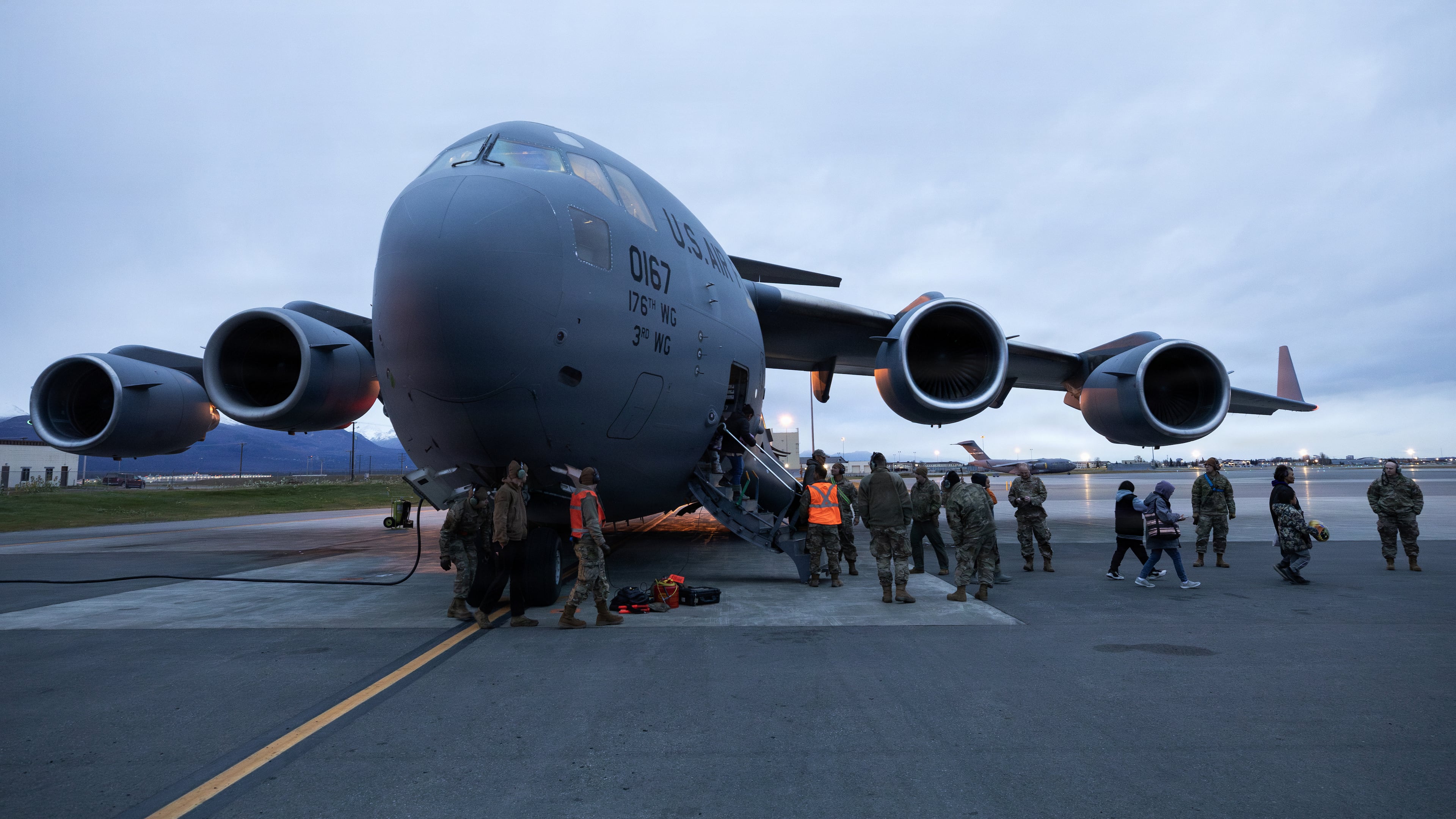 In this photo provided by the Alaska National Guard, an Alaska Air National Guard C-17 Globemaster III, assigned to the 176th Wing, arrives at Joint Base Elmendorf-Richardson, Alaska, with evacuated residents from western Alaska, Wednesday, Oct. 15, 2025. (Alejandro Pena/Alaska National Guard via AP)