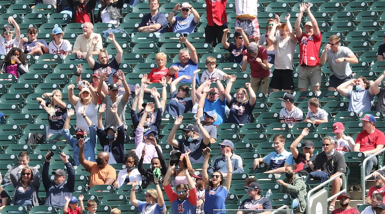 Braves fans get the wave going during a game at Truist Park on April 15, 2021.  “Curtis Compton / Curtis.Compton@ajc.com”