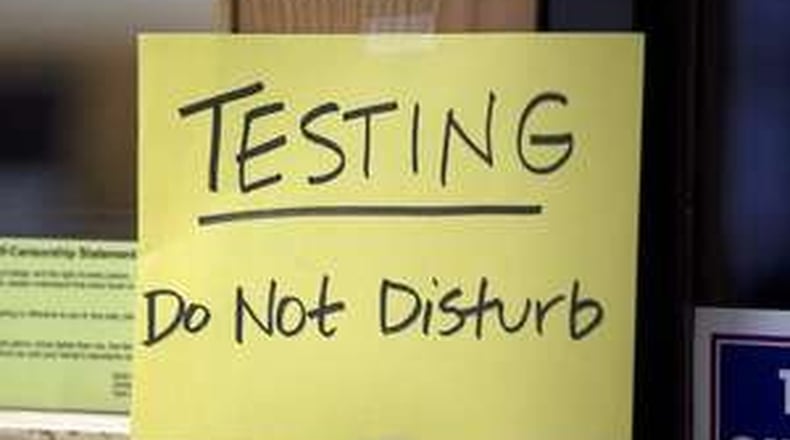 In this American-Statesman file photo, a sign is taped outside a classroom as students take the STAAR test at an Austin area school.