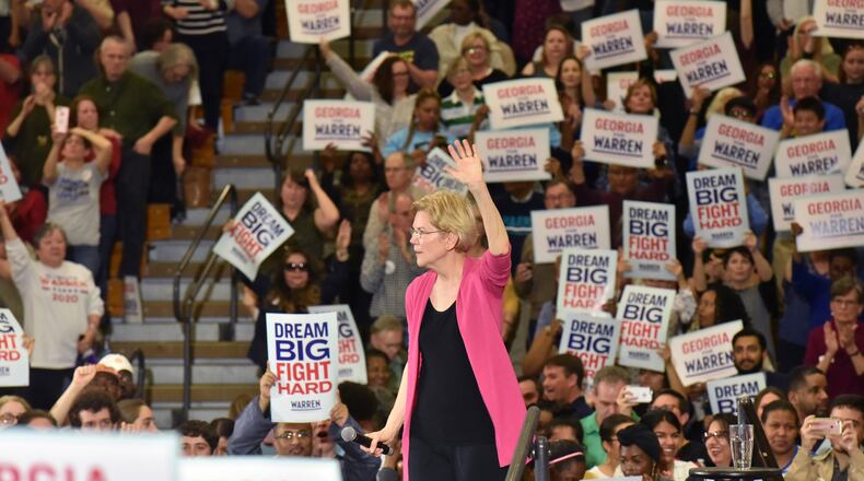 U.S. Sen. Elizabeth Warren of Massachusetts waves to supporters during a rally at Central Gwinnett High School, becoming the first Democrat to hold a campaign event in Georgia this year after launching a presidential bid. Gwinnett Democrats are touting the county, with its diverse population, as the future of the party and a destination for its presidential candidates. HYOSUB SHIN / HSHIN@AJC.COM