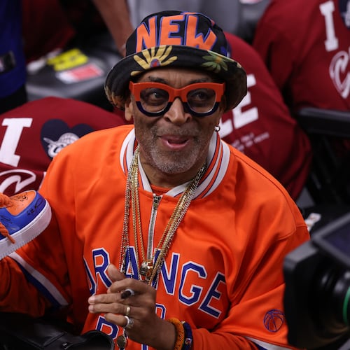 Spike Lee holds an autographed shoe before Game 4 in the Eastern Conference finals NBA basketball playoffs series between the New York Knicks and the Cleveland Cavaliers in Cleveland, Monday, May 25, 2026. (AP Photo/Tim Phillis)