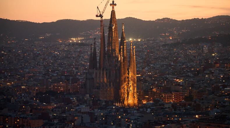 Antoni Gaudí's Basilica of the Sagrada Família stands at dusk as seen from the Mirador Torre Glòries in Barcelona, Spain, Tuesday, June 9, 2026. (AP Photo/Emilio Morenatti)