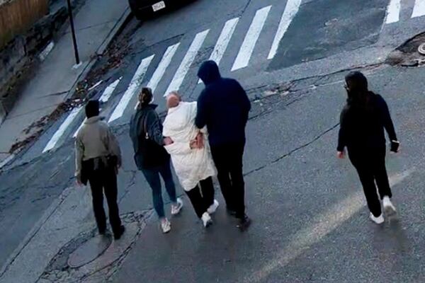 In this image taken from security camera video, Rumeysa Ozturk, a 30-year-old doctoral student at Tufts University, is detained by Department of Homeland Security agents on a street in Sommerville, Mass., Tuesday, March 26, 2025. (AP Photo)