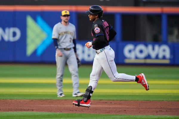 New York Mets' Francisco Lindor (12) runs the bases after hitting a home run during the second inning in the second baseball game of a doubleheader against the Milwaukee Brewers Wednesday, July 2, 2025, in New York. (AP Photo/Frank Franklin II)