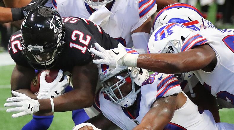 Falcons wide receiver Mohamed Sanu is stopped just short of the end zone by Bills defenders setting up a Devonta Freeman touchdown run on the next play for a 10-7 lead during the first half Sunday, Oct. 1, 2017, in Atlanta