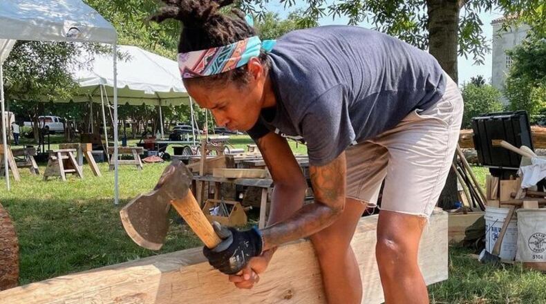 Volunteers with the non-profit Handshouse Studio built a full-size, three-ton replica of one of the mortise-and-tenon trusses from the roof of the Notre-Dame Cathedral to draw attention to the effort to repair the cathedral. That truss is on display at the Millennium Gate Museum in Atlanta through April 24. Photo: Handshouse Studio