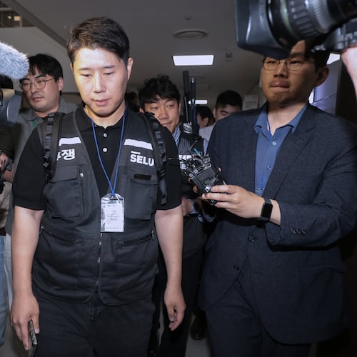 Choi Seung-ho, a leader of the Samsung Electronics labor union, leaves after attending the government-led mediation talks with management at the National Labor Relations Commission office in Sejong, South Korea, Wednesday, May 20, 2026 (Yonhap via AP)
