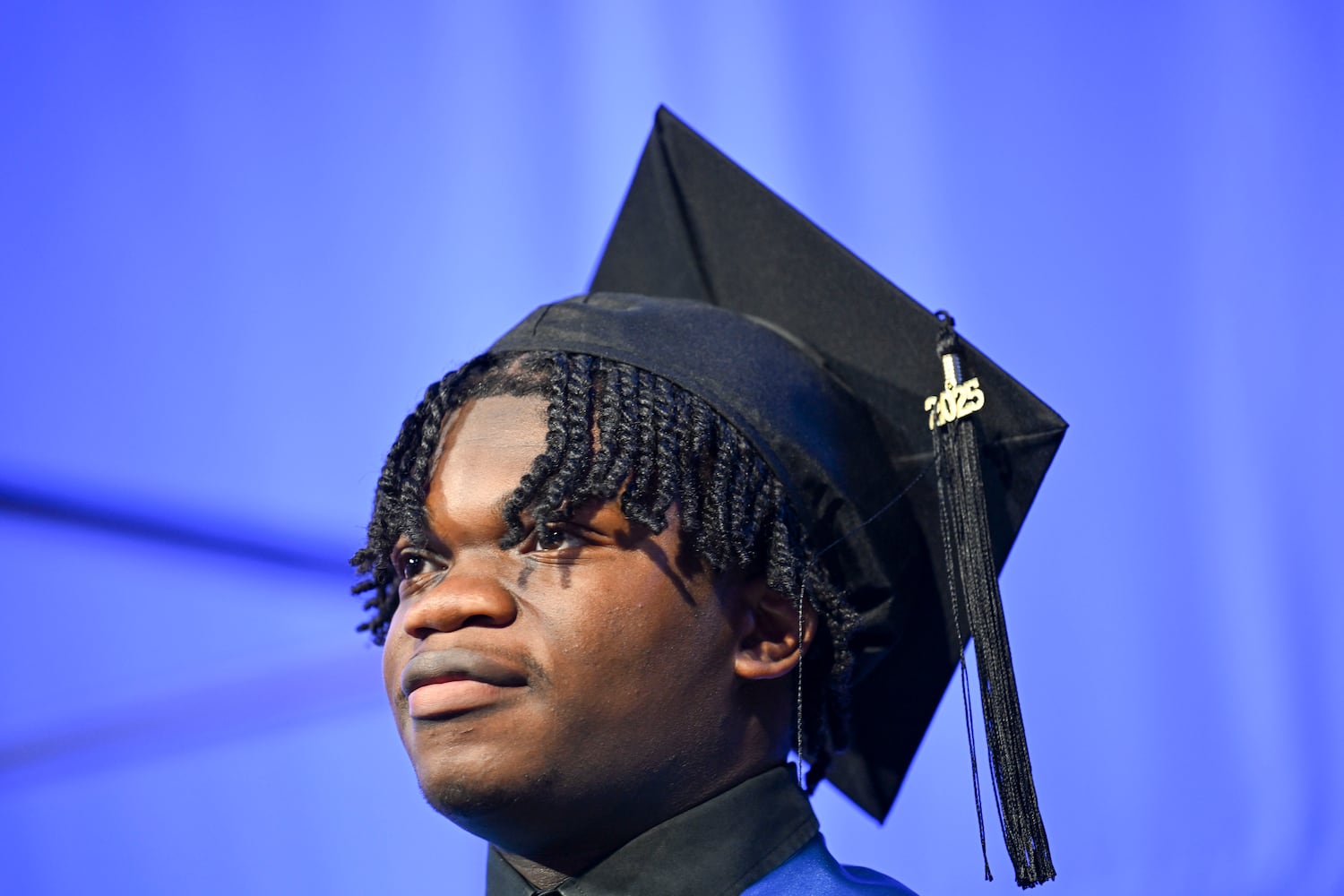 Jermaine Louis walks across the stage during Georgia State University’s Spring commencement ceremony for the College of Arts & Sciences Wednesday, May 7, 2025 in Atlanta. (Daniel Varnado/For the Atlanta Journal-Constitution)