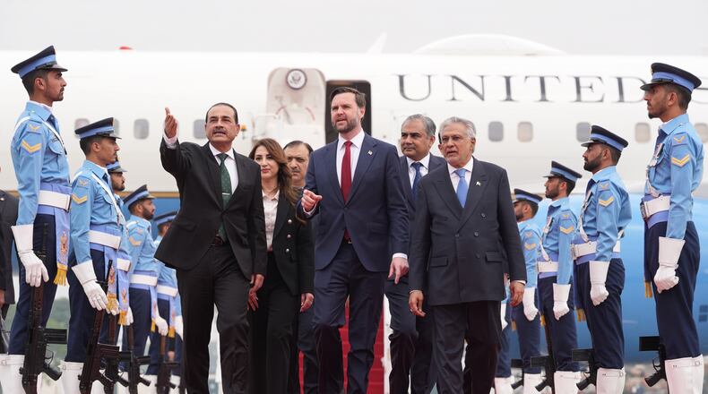 U.S. Vice President JD Vance, center, walks with Pakistan's Chief of Defence Forces and Chief of Army Staff Field Marshall Asim Munir, left, and Pakistani Deputy Prime Minister and Foreign Minister Mohammad Ishaq Dar after arriving for talks with Iranian officials in Islamabad, Pakistan, Saturday, April 11, 2026. (AP Photo/Jacquelyn Martin, Pool)