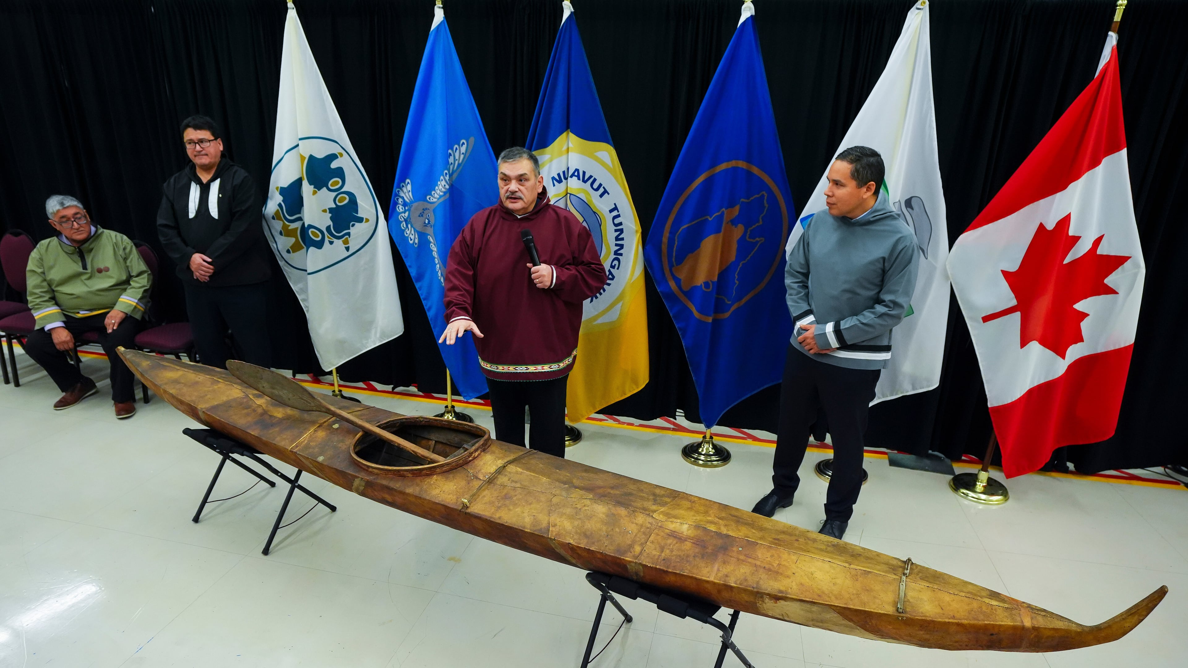 Paul Irngaut, Acting President of Nunavut Tunngavik Inc., left to right, Duane Smith, Chair and CEO of the Inuvialuit Regional Corp., Darrel Nasogaluak, Elder and Chair of Tuktoyaktuk Community Corp., and Natan Obed, President of Inuit Tapiriit Kanatami answer questions after the unveiling of a traditionally built Inuvialuit kayak and a selection of Inuit items at the Canadian Museum of History in Gatineau, Que., on Tuesday, Dec. 9, 2025. (Sean Kilpatrick /The Canadian Press via AP)
