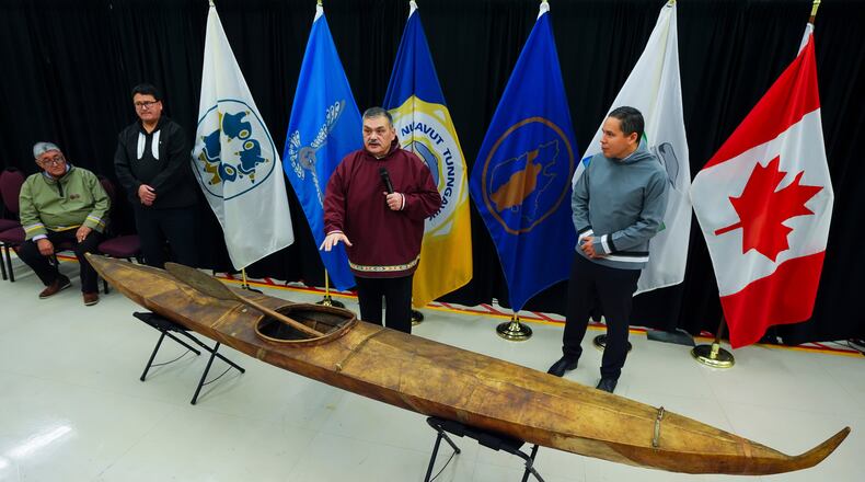 Paul Irngaut, Acting President of Nunavut Tunngavik Inc., left to right, Duane Smith, Chair and CEO of the Inuvialuit Regional Corp., Darrel Nasogaluak, Elder and Chair of Tuktoyaktuk Community Corp., and Natan Obed, President of Inuit Tapiriit Kanatami answer questions after the unveiling of a traditionally built Inuvialuit kayak and a selection of Inuit items at the Canadian Museum of History in Gatineau, Que., on Tuesday, Dec. 9, 2025. (Sean Kilpatrick /The Canadian Press via AP)