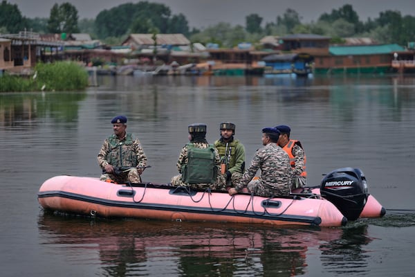 Paramilitary soldiers patrol on an inflatable boat on Dal Lake after loud explosions were heard in Srinagar, Indian controlled Kashmir, Saturday, May 10, 2025.(AP Photo/Mukhtar Khan)