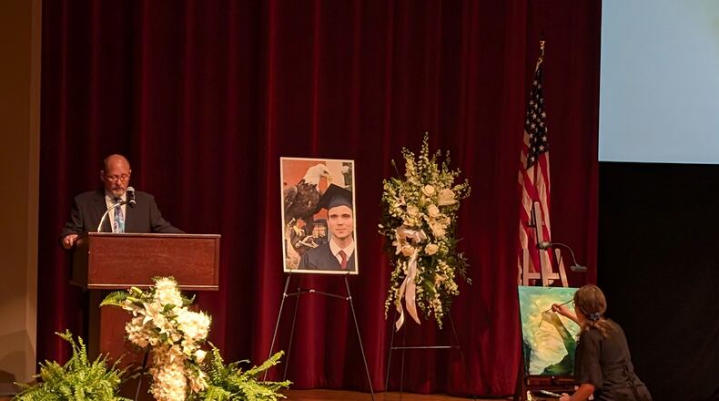 Pastor Mark Snavely from Coastal Community Christian Church speaks at a memorial service for Sam Lilley at Georgia Southern University's Armstrong campus in Savannah, Georgia on Saturday, Feb. 15, 2025. Lilley, an airline pilot, was killed in a midair collision with a U.S. Army helicopter in Washington on Jan. 29. (Jim Halley for the AJC)