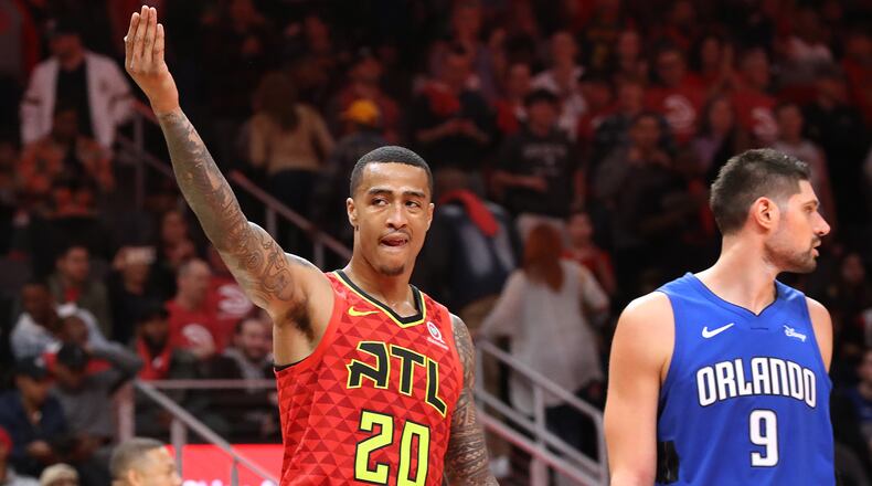 Atlanta Hawks forward John Collins encourages the fans to make noise in the final minutes of a 103-99 victory over the Orlando Magic in the home opener in a NBA basketball game on Saturday, October 26, 2019, in Atlanta.   Curtis Compton/ccompton@ajc.com