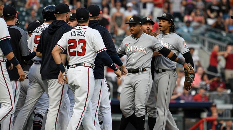 Jose Urena (right) was ejected after plunking the Braves' Ronald Acuna.