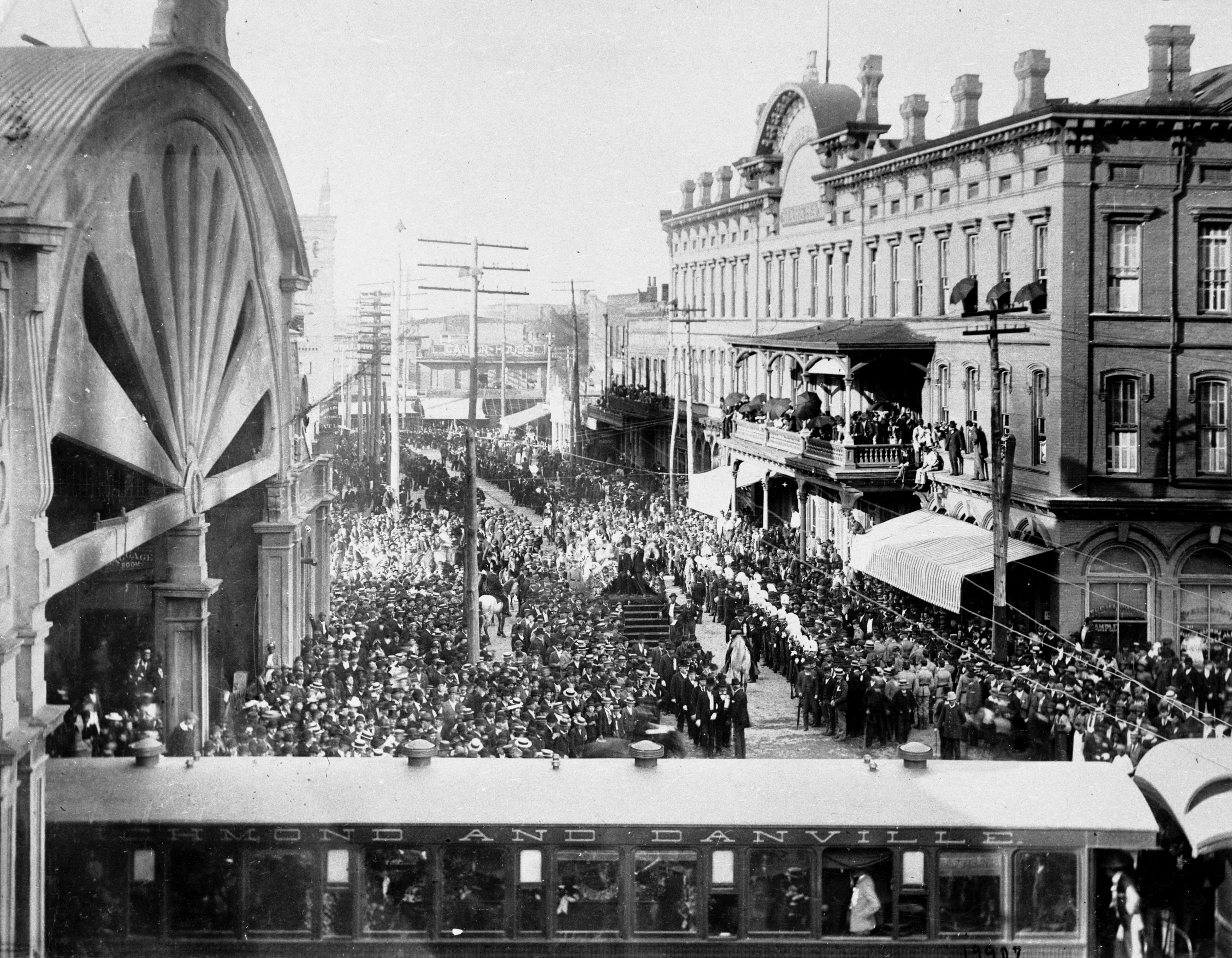 In 1887, Atlantans gathered at Union Station (also known as Union Depot) to greet President Grover Cleveland as he arrived aboard a passenger train. Cleveland delivered a speech at the Markham Hotel, shown at right. The street at the center of the photograph is Loyd Avenue, which is now called Central Avenue. The Zero Milepost is visible within the station at left. (Courtesy of Atlanta History Center)