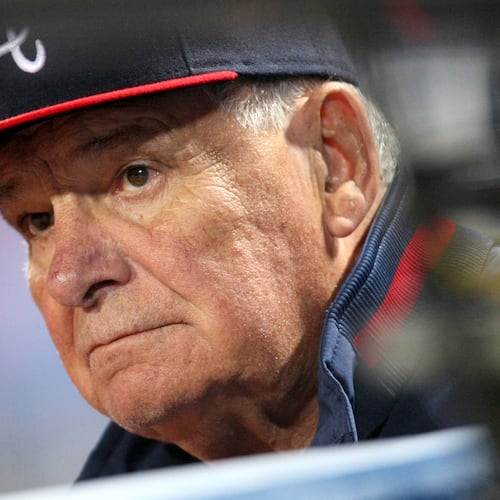 Braves manager Bobby Cox stands near the tunnel in the dugout during a game against the Philadelphia Phillies at Turner Field on April 20, 2010. (Jason Getz/AJC file)