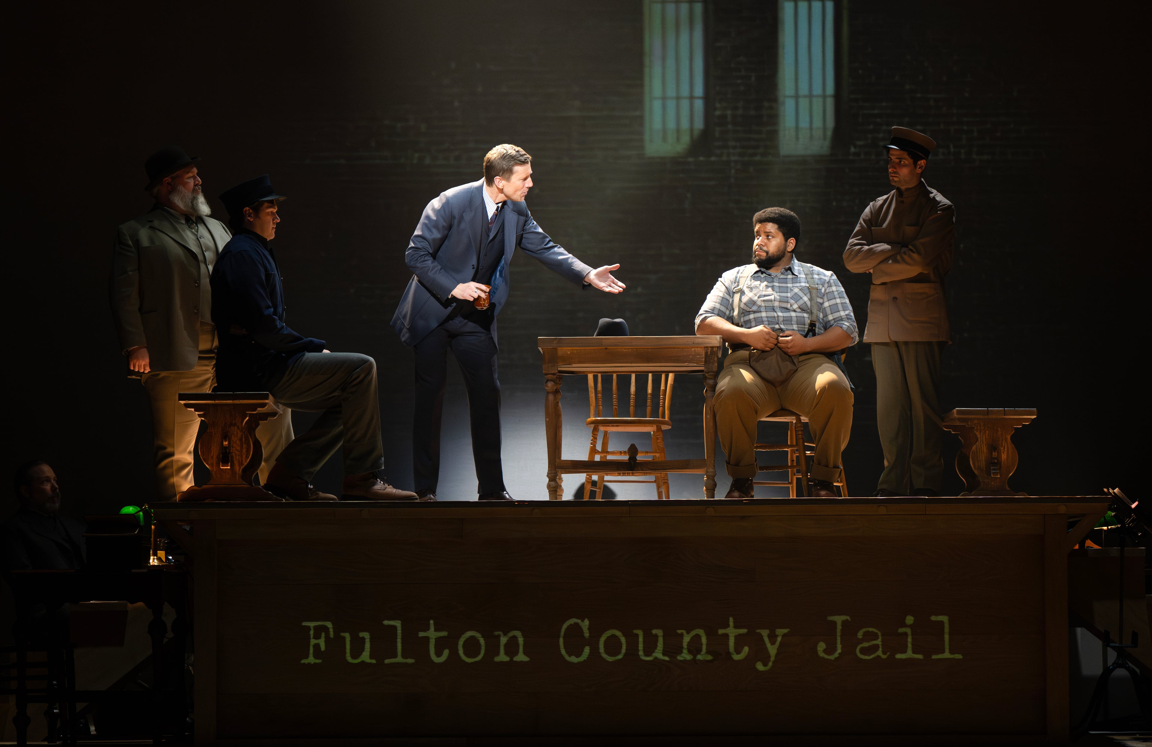 A Fulton County courtroom scene unfolds on stage during a staging of "Parade," a musical about the century-old Leo Frank case. "Parade" will be at the Fox Theatre April 1-6.