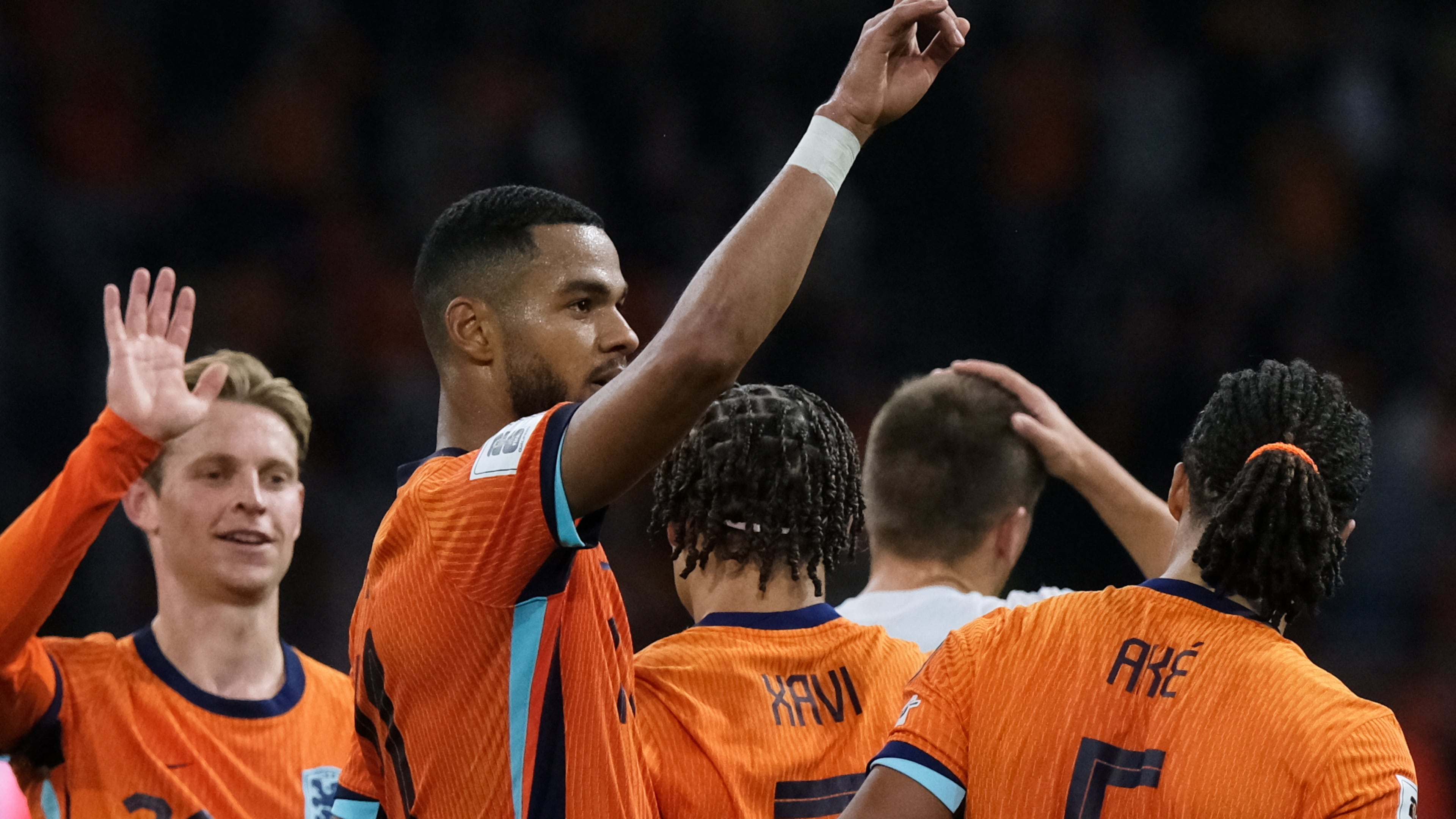Netherlands' Cody Gakpo, center, celebrates after scoring his side's fourth goal during a World Cup 2026 group G qualifying soccer match between the Netherlands and Finland in Amsterdam, Sunday, Oct. 12, 2025. (AP Photo/Patrick Post)