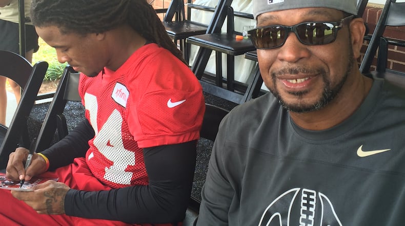 Falcons running back Devonta Freeman spending some time with his mentor and youth coach Luther Campbell at Falcons practice on Sunday, August 9, 2015. (By D. Orlando Ledbetter/dledbetter@ajc.com)