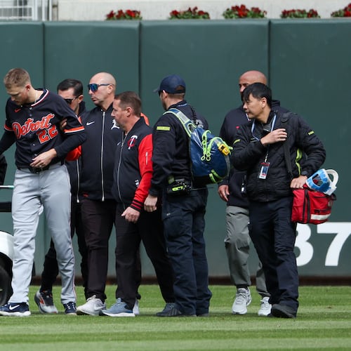 Detroit Tigers center fielder Parker Meadows is helped off the field after a collision with left fielder Riley Greene during the eighth inning of baseball game against the Minnesota Twins, Thursday, April 9, 2026, in Minneapolis. (AP Photo/Matt Krohn)
