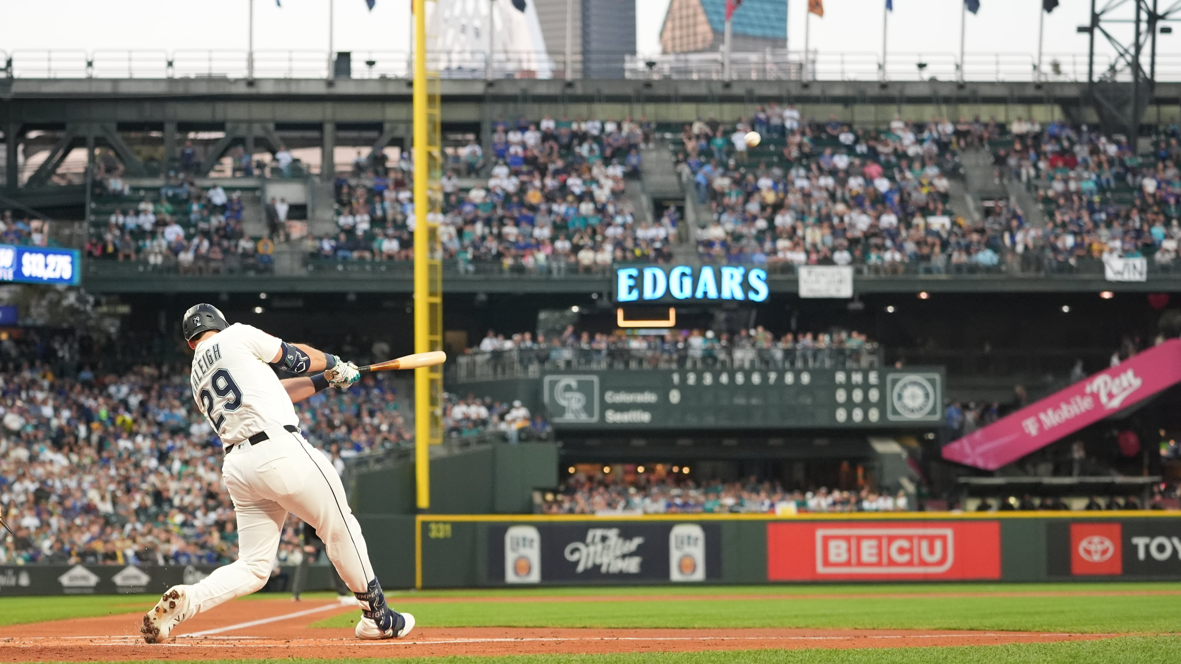 Seattle Mariners' Cal Raleigh hits a solo home run during the first inning of a baseball game against the Colorado Rockies, Wednesday, Sept. 24, 2025, in Seattle. (AP Photo/Ryan Sun)