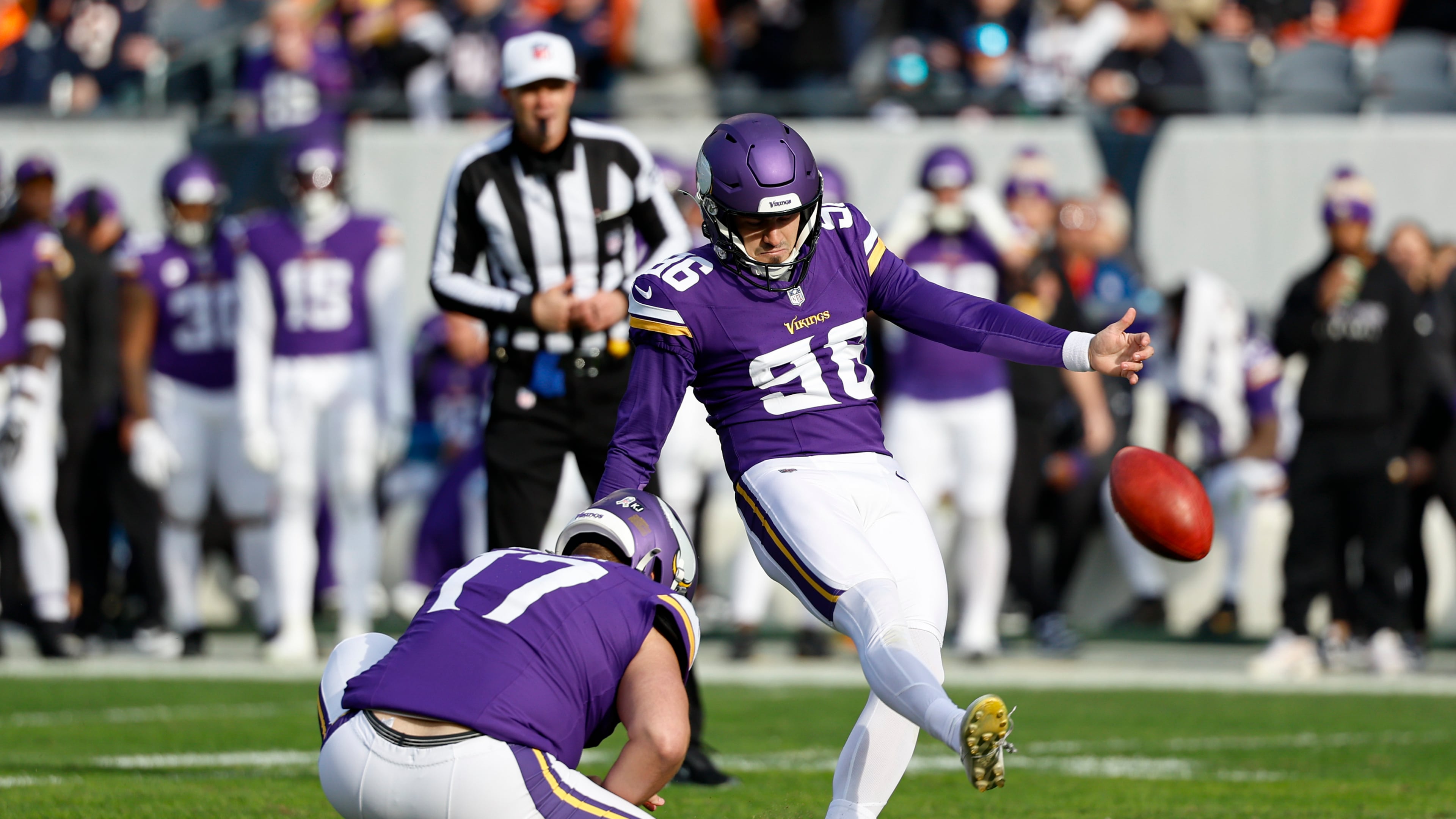FILE - Minnesota Vikings place kicker John Parker Romo (96) kicks a field goal during the first half of an NFL football game against the Chicago Bears, Sunday, Nov. 24, 2024, in Chicago. (AP Photo/Kamil Krzaczynski, File)