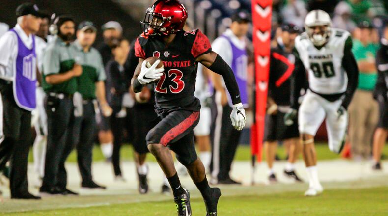 Former San Diego State defensive back Damontae Kazee of runs with the ball after intercepting a pass  against Hawaii  in Qualcomm Stadium on November 5, 2016 in San Diego, Calif. He scored on the play.