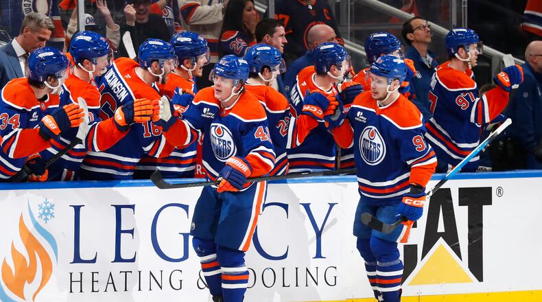 Edmonton Oilers' Kasperi Kapanen (42) celebrates the game-winning goal against the Anaheim Ducks during the third period of an NHL playoff game in Edmonton on Monday, April 20, 2026. (Codie McLachlan/The Canadian Press via AP)