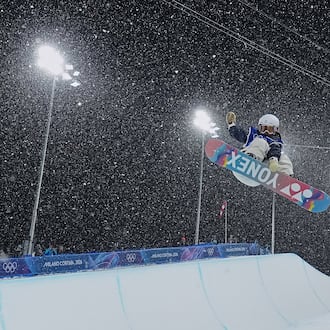 Japan's Sena Tomita competes during the women's snowboarding halfpipe finals at the 2026 Winter Olympics, in Livigno, Italy, Thursday, Feb. 12, 2026. (Gregory Bull/AP)