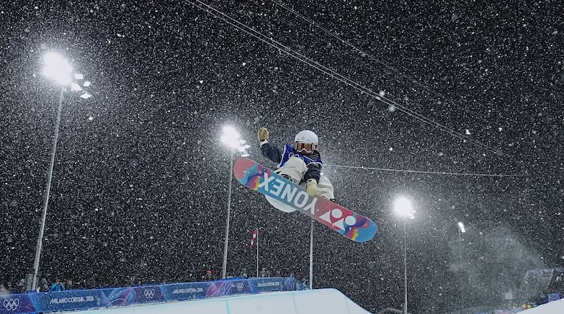 Japan's Sena Tomita competes during the women's snowboarding halfpipe finals at the 2026 Winter Olympics, in Livigno, Italy, Thursday, Feb. 12, 2026. (Gregory Bull/AP)