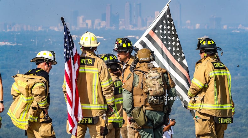 The firefighters climbed to the top of the mountain Wednesday morning.
