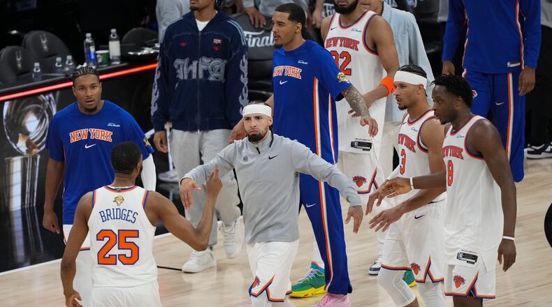 The New York Knicks celebrate after Game 1 of the NBA Finals basketball series against the San Antonio Spurs, Wednesday, June 3, 2026, in San Antonio. (AP Photo/Eric Gay)