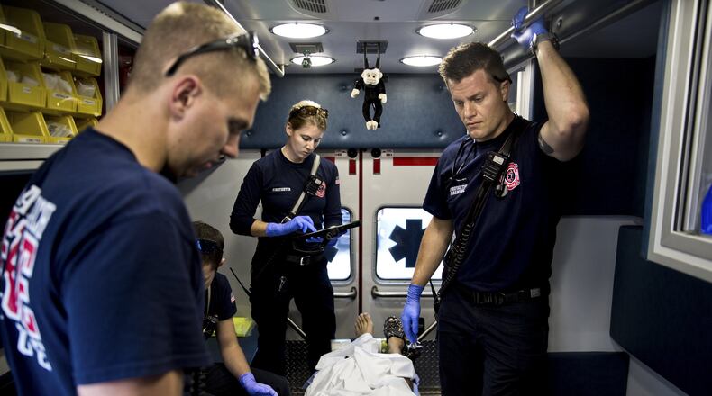 Paramedics treat a patient who overdosed on heroin in Delray Beach, Fla., on Feb. 2, 2017. Americans are more likely to die of an opioid overdose than in a car crash, according to a report by the National Safety Council that analyzed preventable deaths in 2017. Scott McIntyre/The New York Times