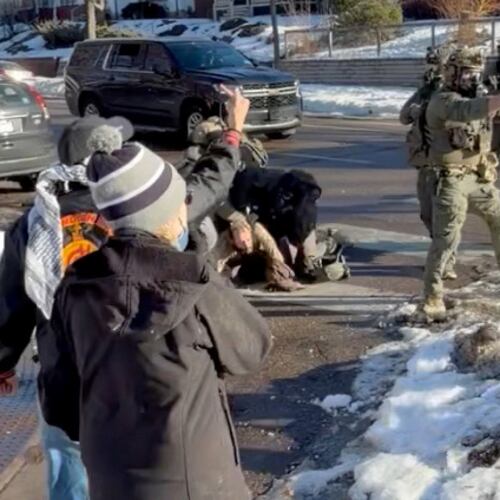 This image taken from video by Max Shapiro shows Alex Pretti, center left, scuffling with federal immigration officers in Minneapolis on Jan. 13, 2026. (Max Shapiro via AP)
