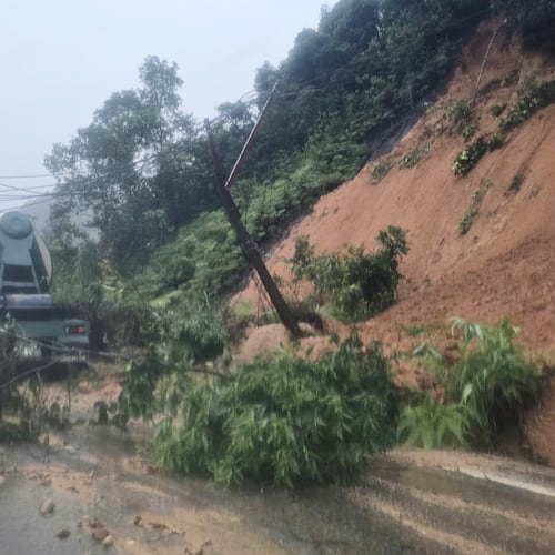 Landslides block the road on Khanh Le pass, near the location where a passenger bus was buried by a landslide in Khanh Hoa, Vietnam, Monday, Nov. 17, 2025. (Dang Tuan/VNA via AP)