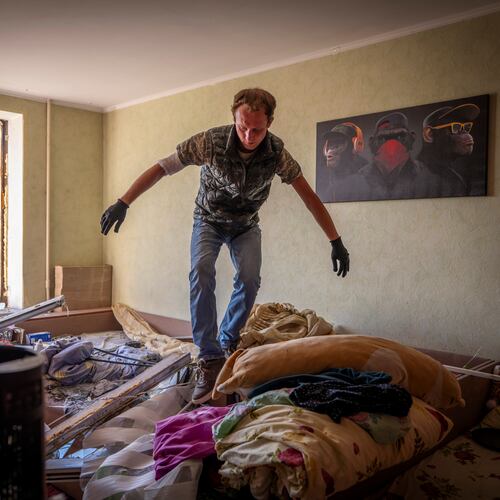 A man inspects damage to his apartment after a Russian missile exploded near his home in Kyiv, Ukraine, Thursday, Sept. 17, 2026. (AP Photo/Dan Bashakov)