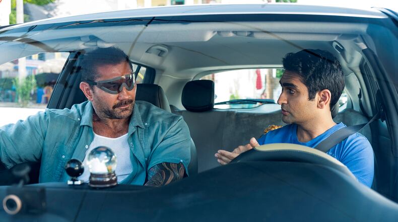 Dave Bautista, left, plays a police detective recovering from eye surgery, and Kumail Nanjiani is his Uber driver in “Stuber.” Mark Hill, Twentieth Century Fox