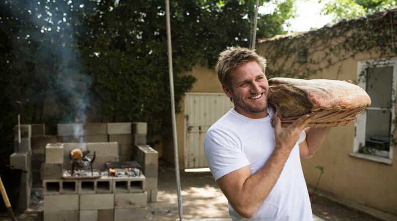 Australian chef Curtis Stone holds a piece of meat at his test kitchen in Beverly Hills, Calif., on June 10, 2016. Stone plans to open a new meat-centric restaurant in Hollywood with his brother, Luke Stone. (Dillon Deaton/Los Angeles Times/TNS)