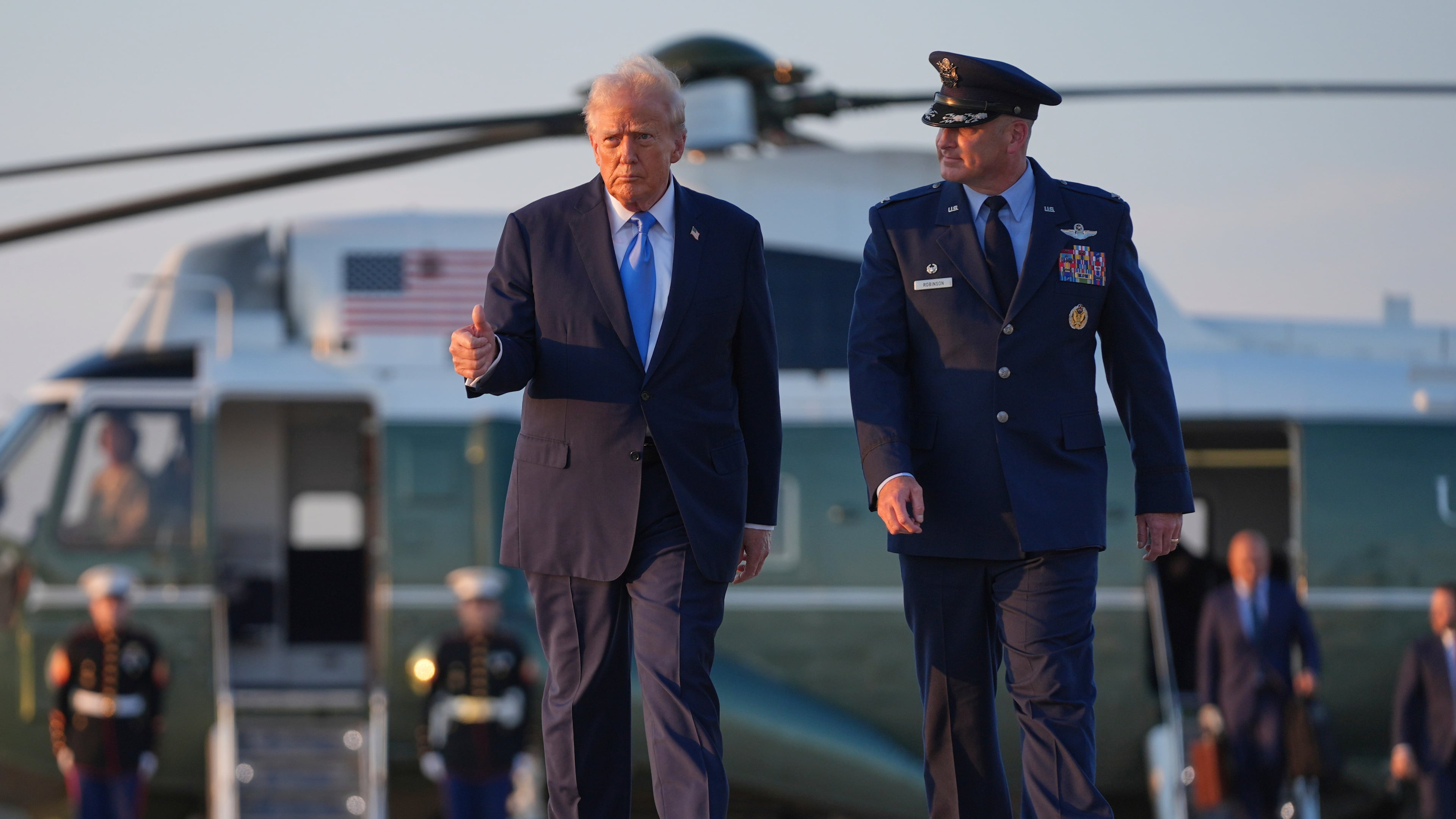 President Donald Trump walks from Marine One with Col. Christopher Robinson, right, commander of the 89th Airlift Wing, to board Air Force One at Joint Base Andrews, Monday, Sept. 22, 2025, at Joint Base Andrews, Md. (AP Photo/Evan Vucci)